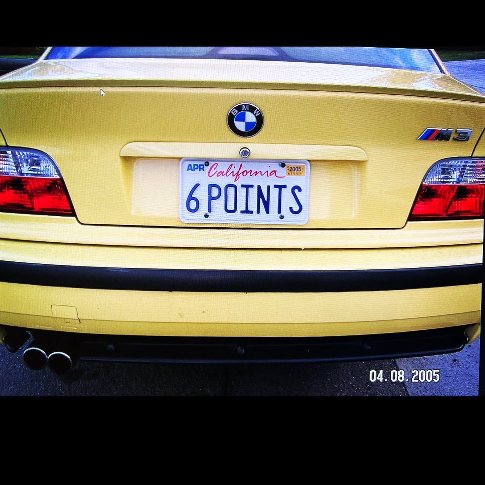 Yellow BMW with 6 POINT S California plates